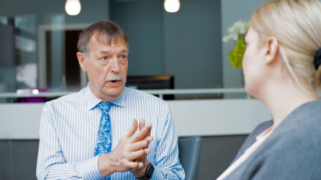 Steve talking with patient